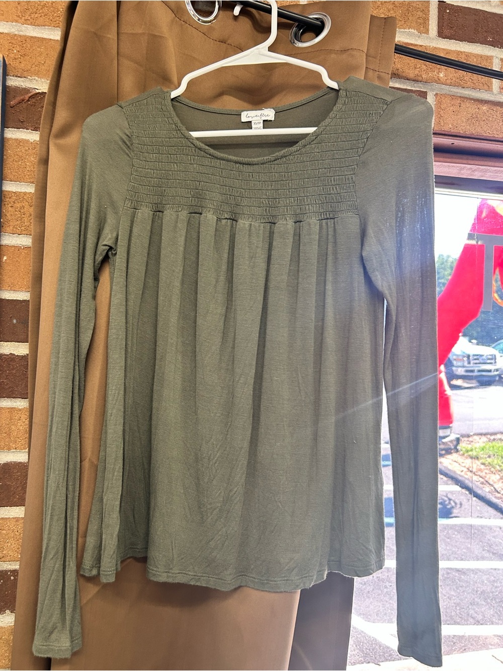 This green Lovefire top features a distinctive smocked yoke design XS
